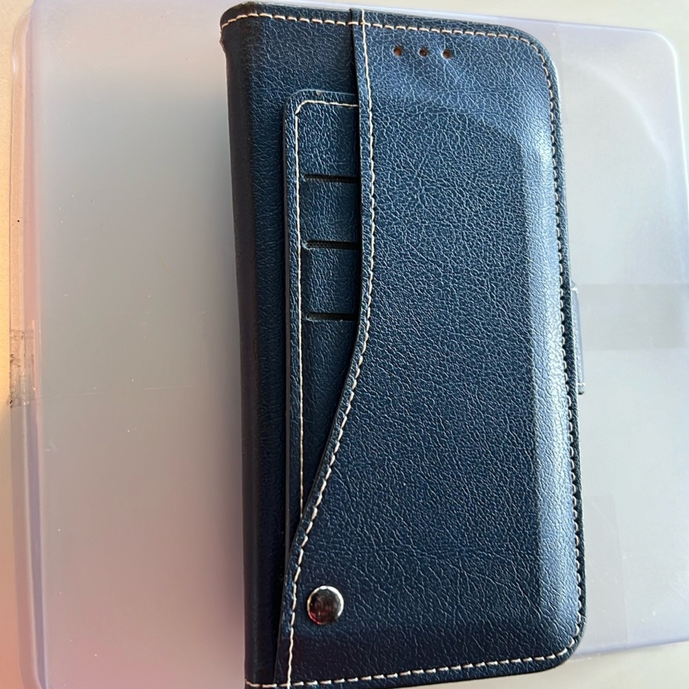 Regular size iphone 11 assorted accessories.